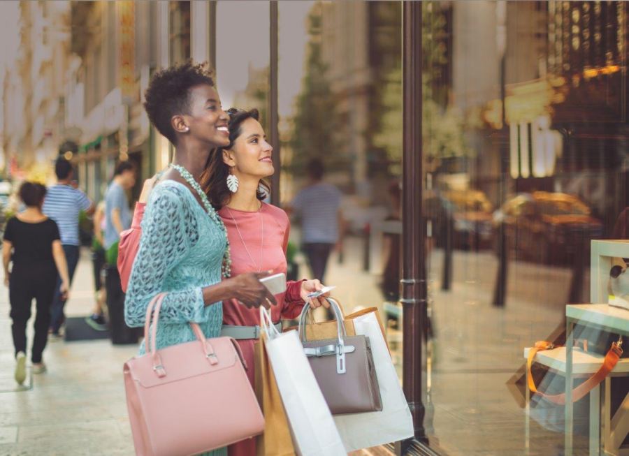 two women holding shopping bags