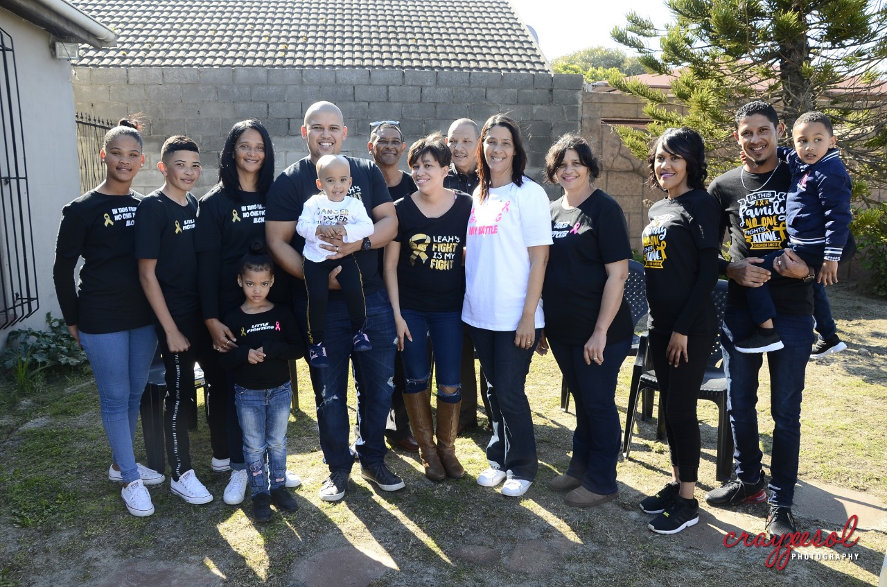 Mita Groenewald (white shirt) with her supportive family