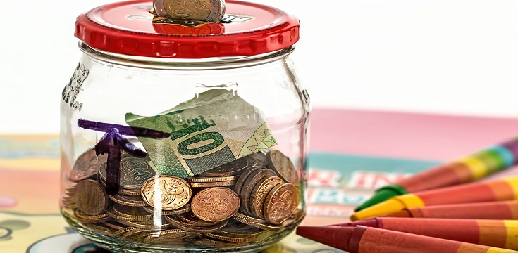 a glass jar with coins inside