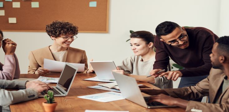 group of people sitting in a office
