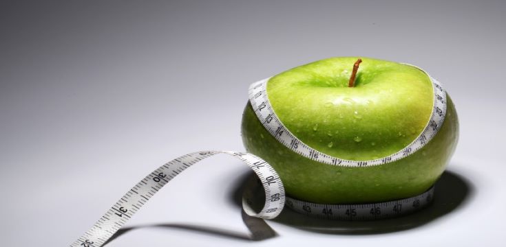 fresh-green-apple-with-measure-tape