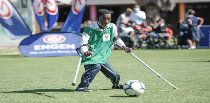 A Tembaletu soccer enthusiastic is loving the new soccer field at his school (002)