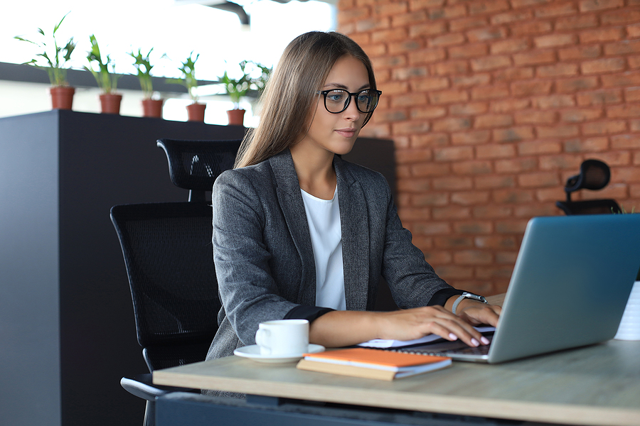 Beautiful Business Woman Working On Laptop In The Office