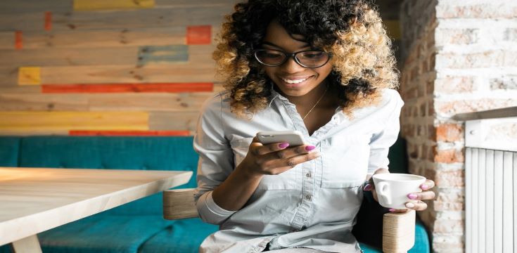 Young-black-female-using-smartphone