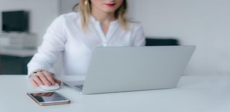Woman-using-silver-laptop