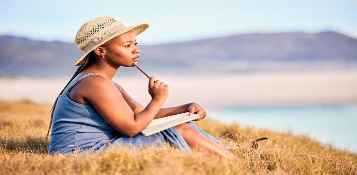 young-woman-writing-her-journal-beach