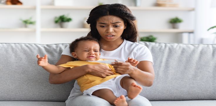 high-fever-concerned-black-mom-checking-temperature