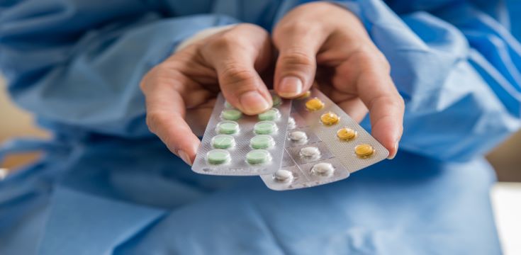 woman-hand-holding-contraceptive-panel-prevent-pregnancy