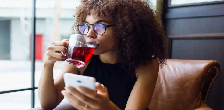 Young woman drinking tea