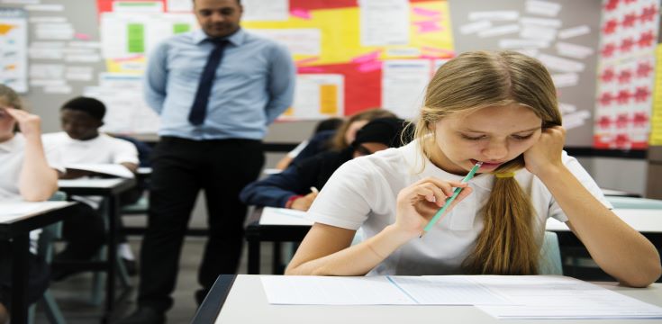 students-doing-the-exam-in-classroom