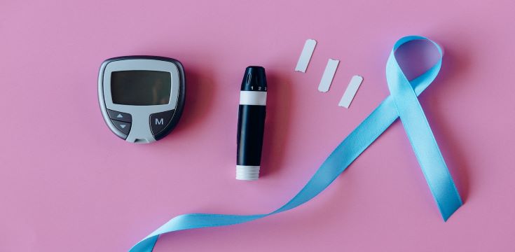 Black and White Marker Beside Pink and Black Digital Device