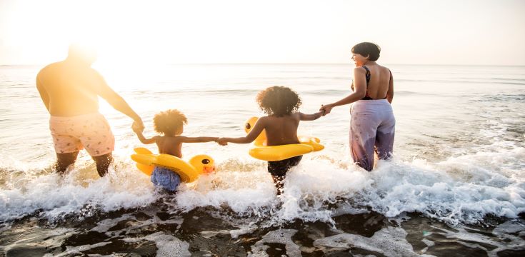 black-family-having-fun-beach