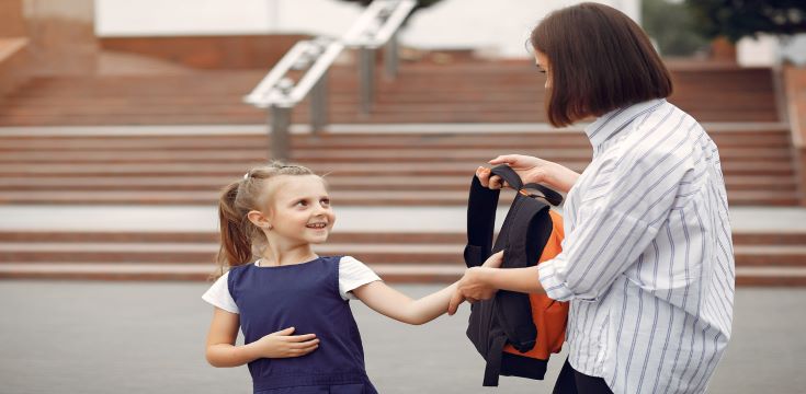 mother-prepare-little-daughter-school