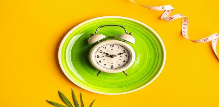 composition-with-plate-alarm-clock-measuring-tape-colored-background-diet-concept-weigh-1[13069]