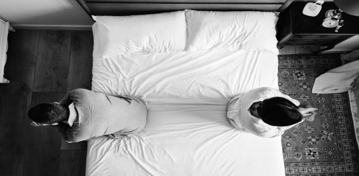 interracial-couple-sitting-back-back-bed[13519]