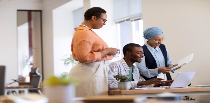 male-employee-getting-used-his-new-office-job-along-with-female-colleagues