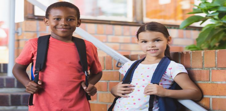 smiling-school-kids-standing-staircase