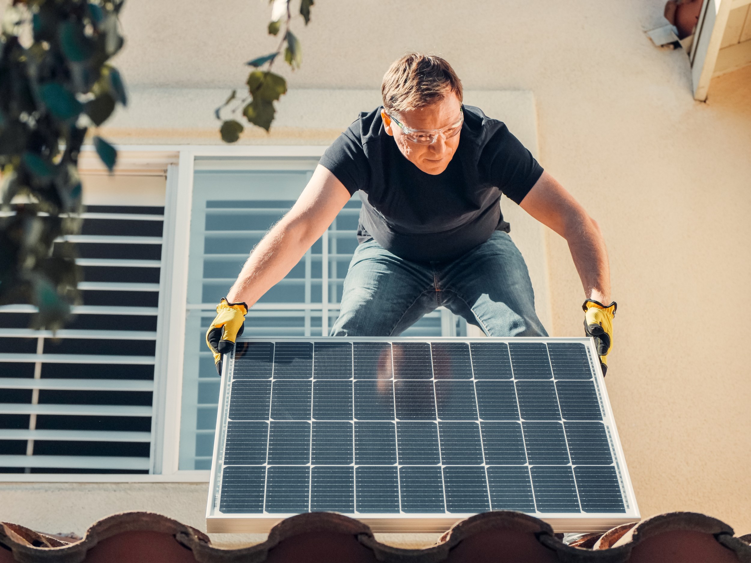 person-installing-solar-home