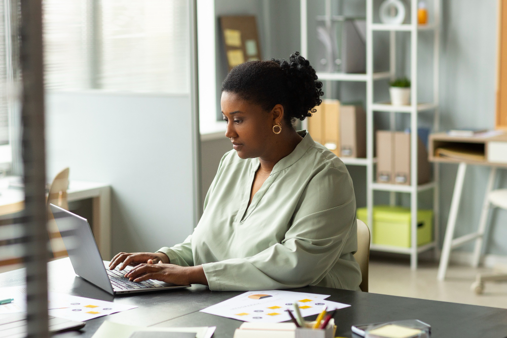 medium-shot-woman-working-laptop