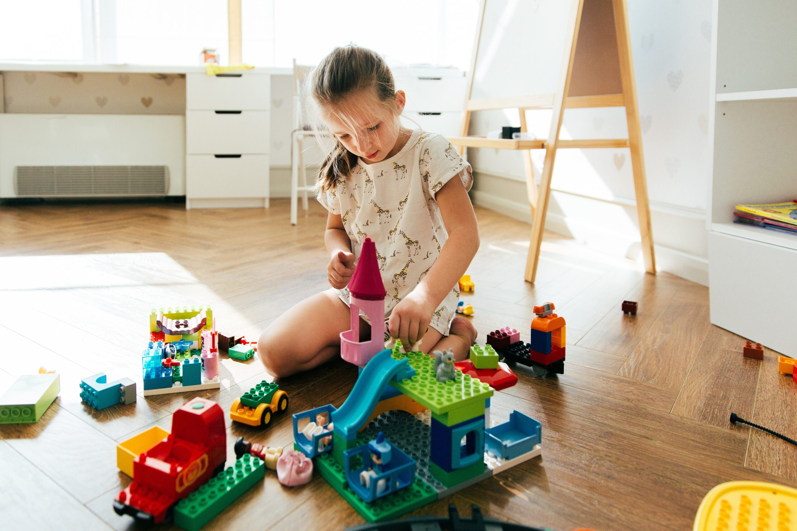 the-girl-sits-on-the-floor-in-the-children-s-room