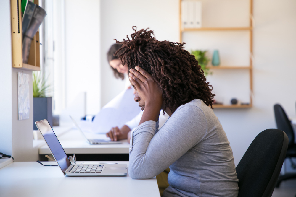 exhausted-african-american-woman-looking-laptop