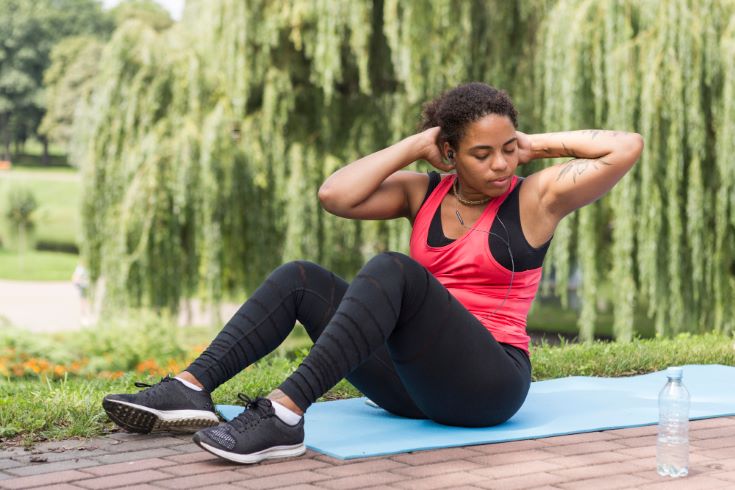 young-woman-doing-exercise-park