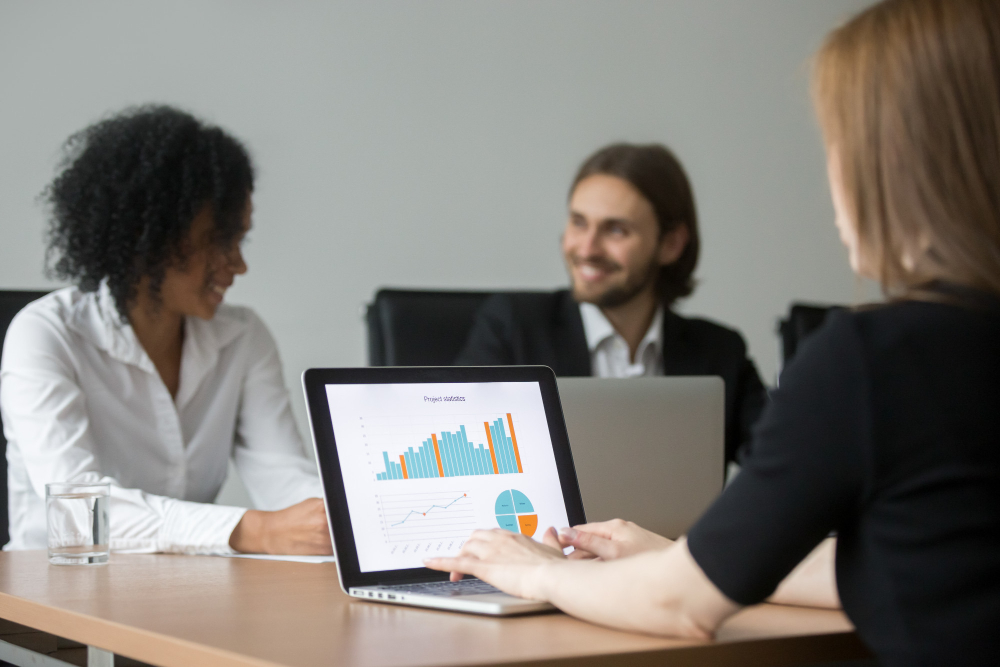 businesswoman-working-with-project-statistics-preparing-report-team-meeting