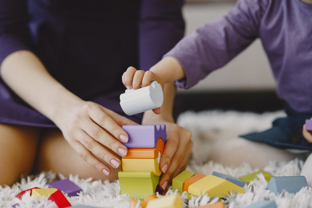 cheerful-mom-playing-laughing-with-little-kid-daughter