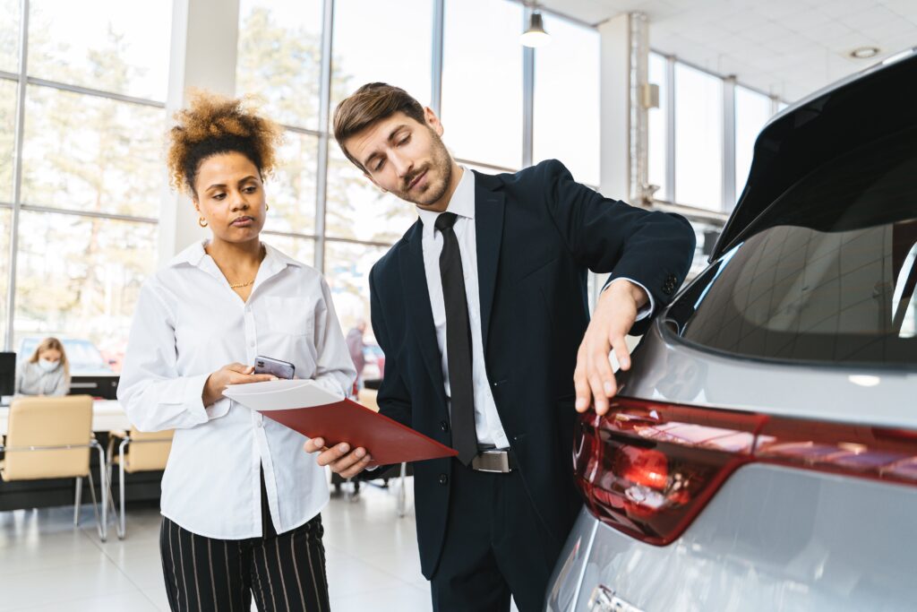 women-looking-at-new-car