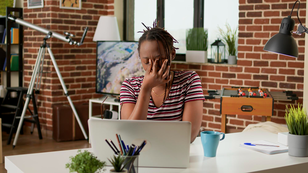 stressed-businesswoman-with-headache-working-remotely-laptop-home-feeling-tired-frustrated-about-work-deadline-doing-remote-job-suffering-from-painful-migraine-tension